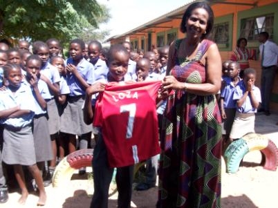  Lucky winner of one of the shirts donated by Great Bentley Primary School. Teacher on the right is Mrs Kavari, the headmaster�s wife.